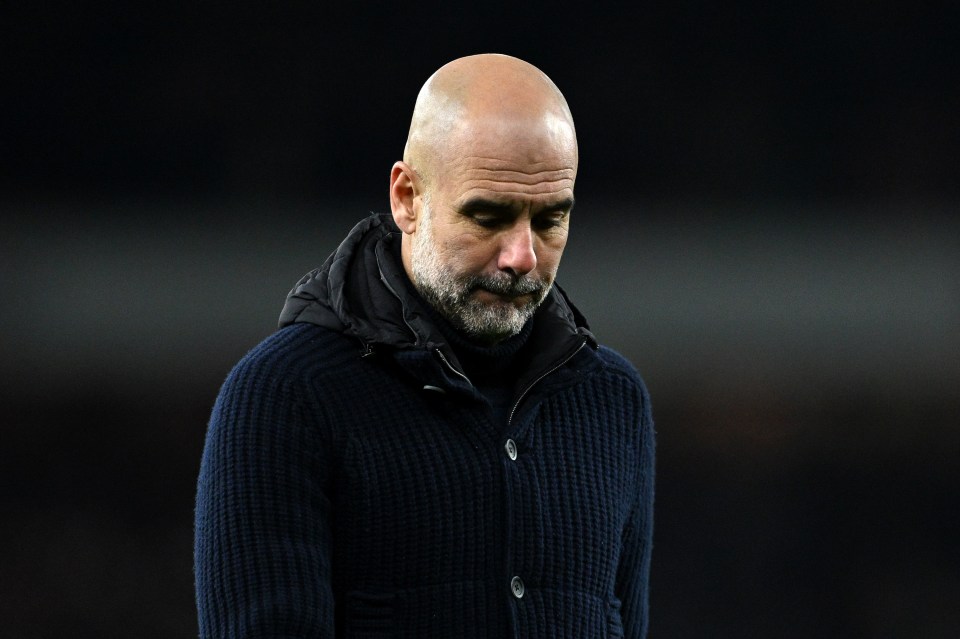 Pep Guardiola, Manchester City manager, looking dejected.