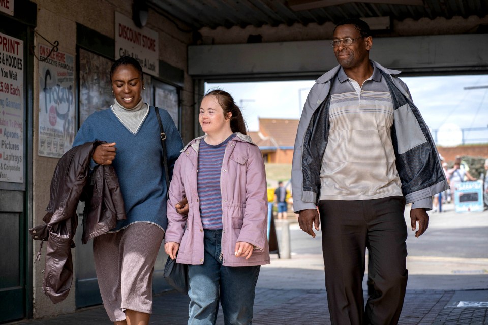 Family walking down a street.