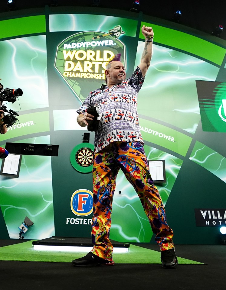 Peter Wright celebrating a darts championship win.