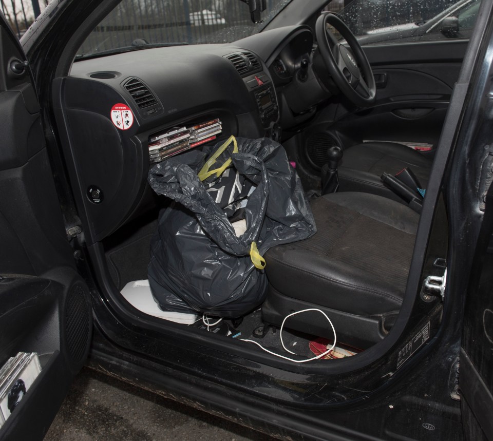 A homeless man's belongings in his car.