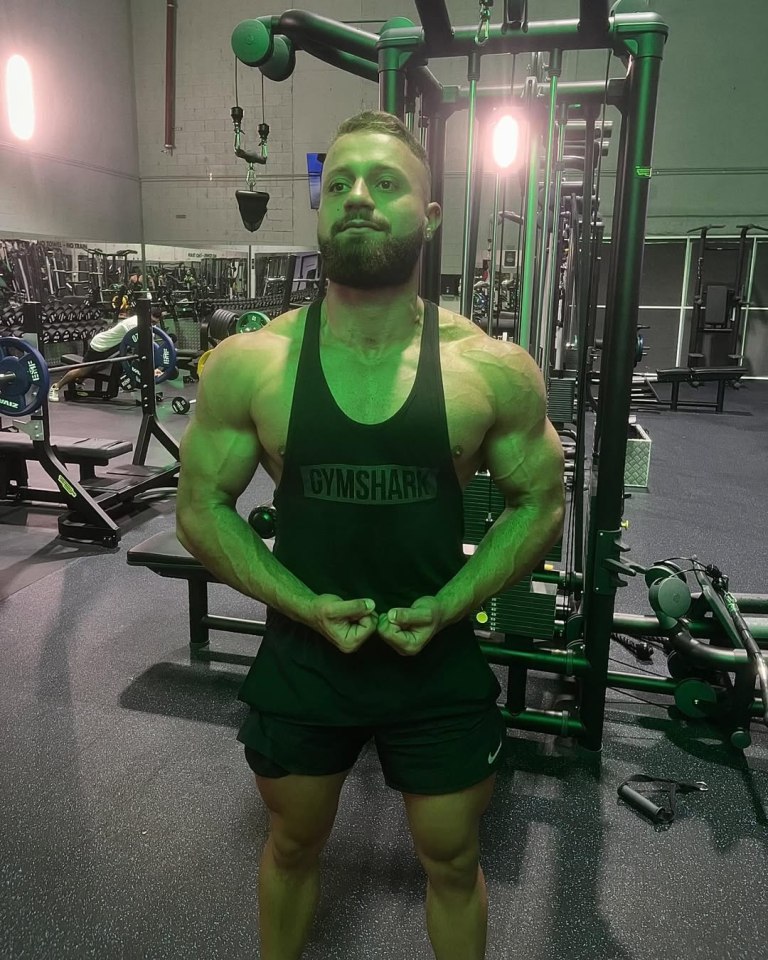 Bodybuilder in gym wearing Gymshark tank top.