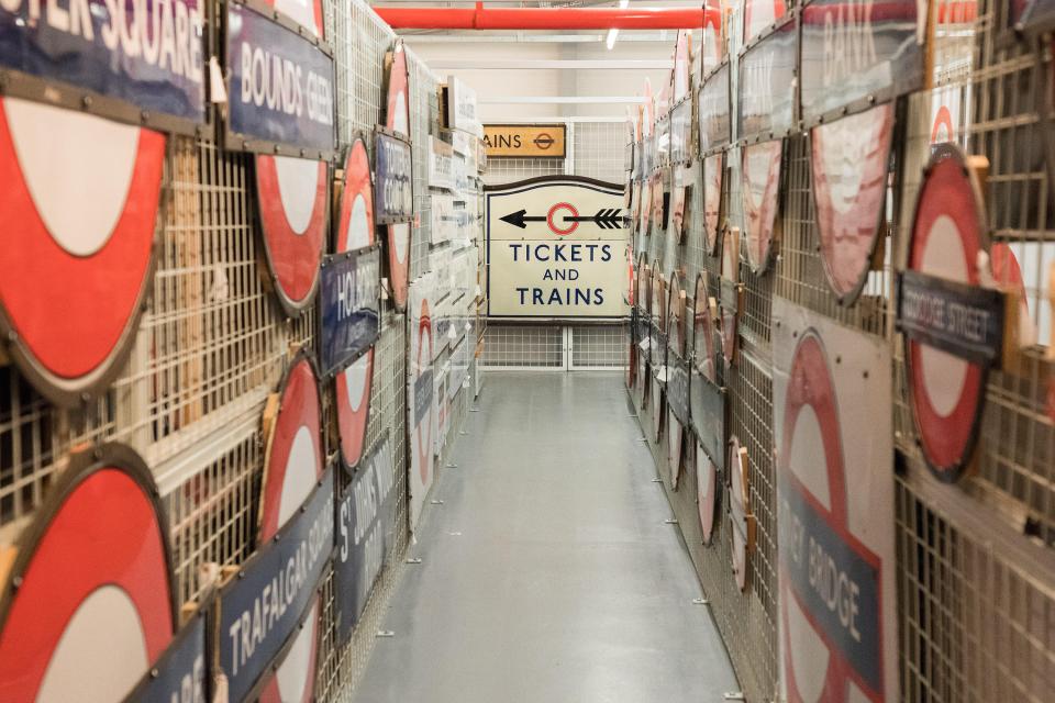 Rows of vintage London Transport Museum signs.