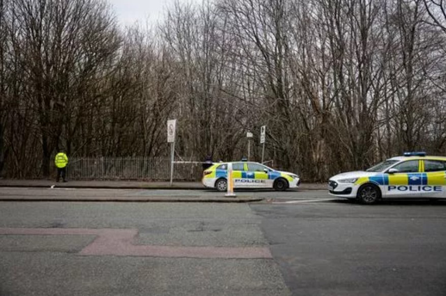 Police cars at a scene in Blackley.