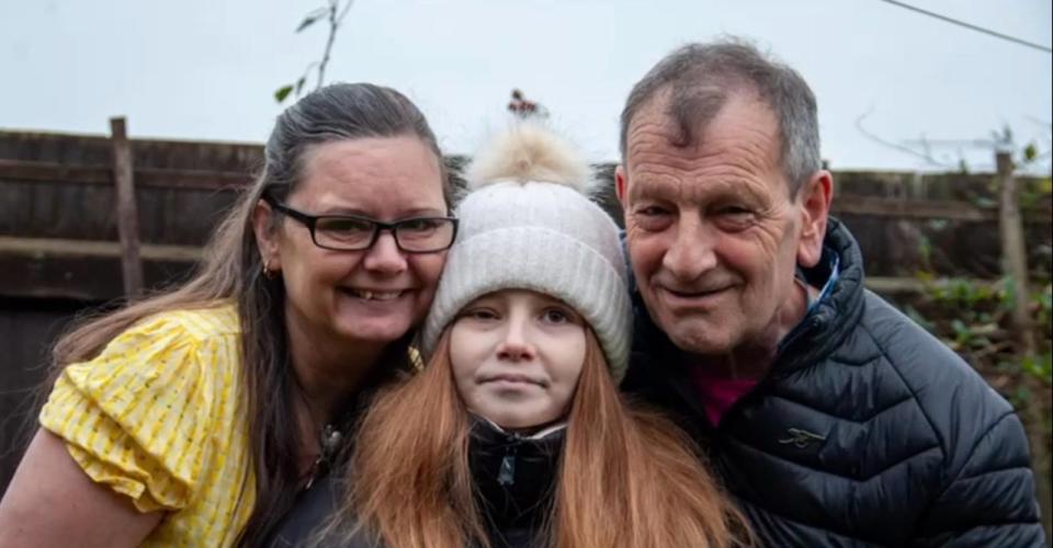 Portrait of a girl with her parents.