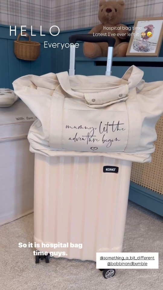 Beige hospital bag on a suitcase; "Mummy, let the adventure begin" is written on the bag.