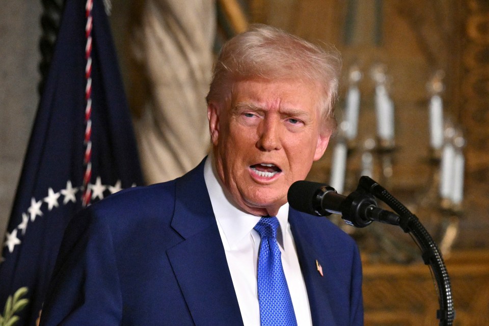 President Donald Trump speaking at a microphone.