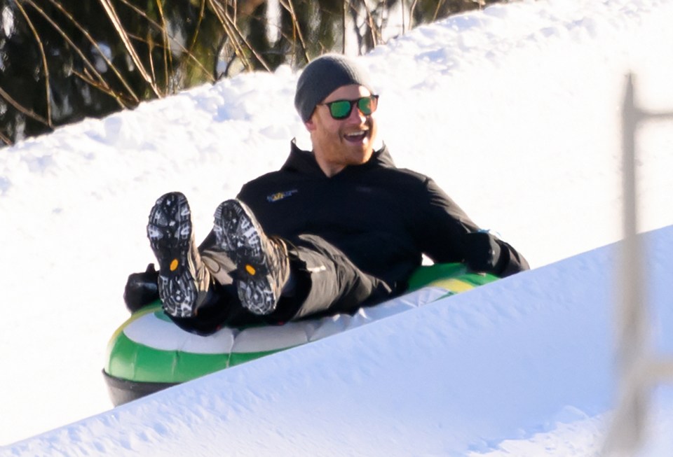 Prince Harry snow tubing.