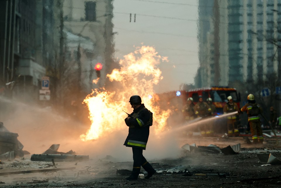 Rescue worker at fire scene in Kyiv, Ukraine.