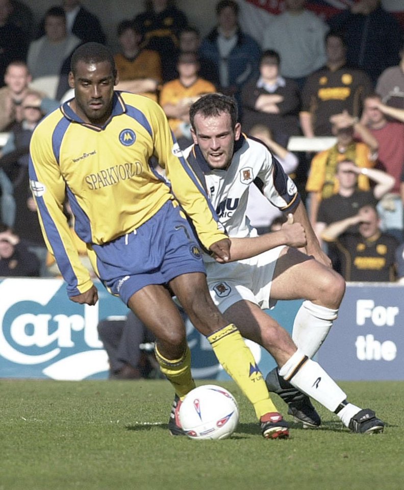 Soccer players vying for the ball.