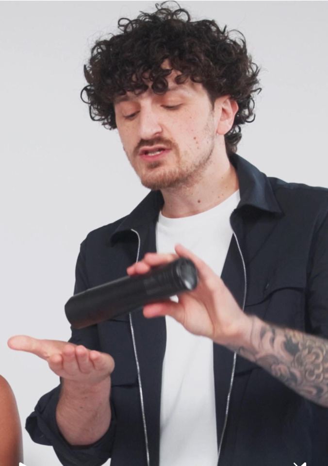 Hairdresser demonstrating hair product.