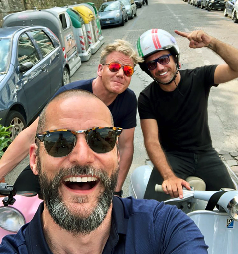 Selfie of Gordon Ramsay, Gino D'Acampo, and Fred Sirieix on scooters.