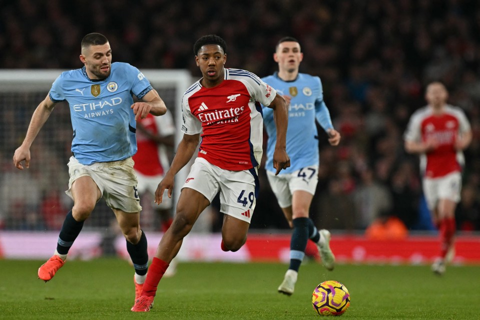 Arsenal's Myles Lewis-Skelly running with the ball during a Premier League match.