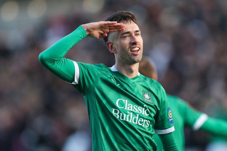 Ryan Hardie of Plymouth Argyle saluting after scoring a goal.