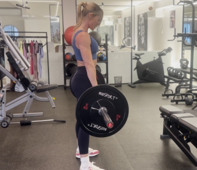 Sarah Lindsay, a three-time winter Olympian, personal trainer, and gym owner, deadlifting in her gym.