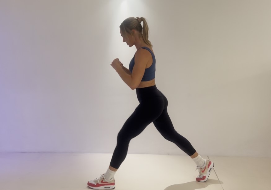 Woman performing a lunge exercise.