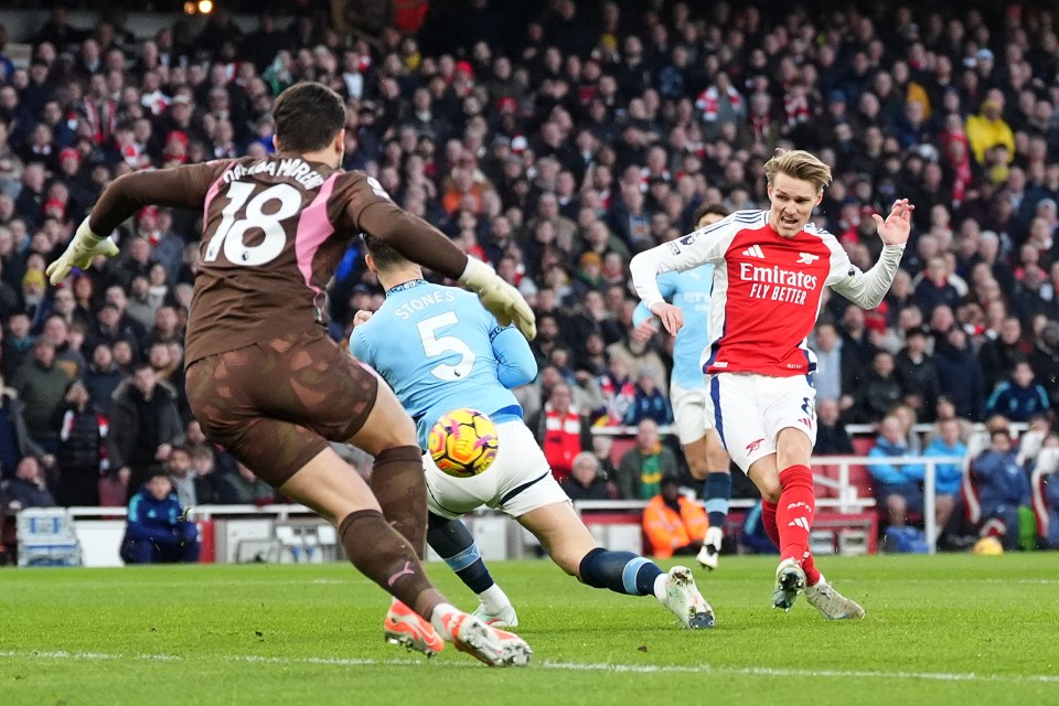 Martin Ødegaard scoring a goal during a soccer game.