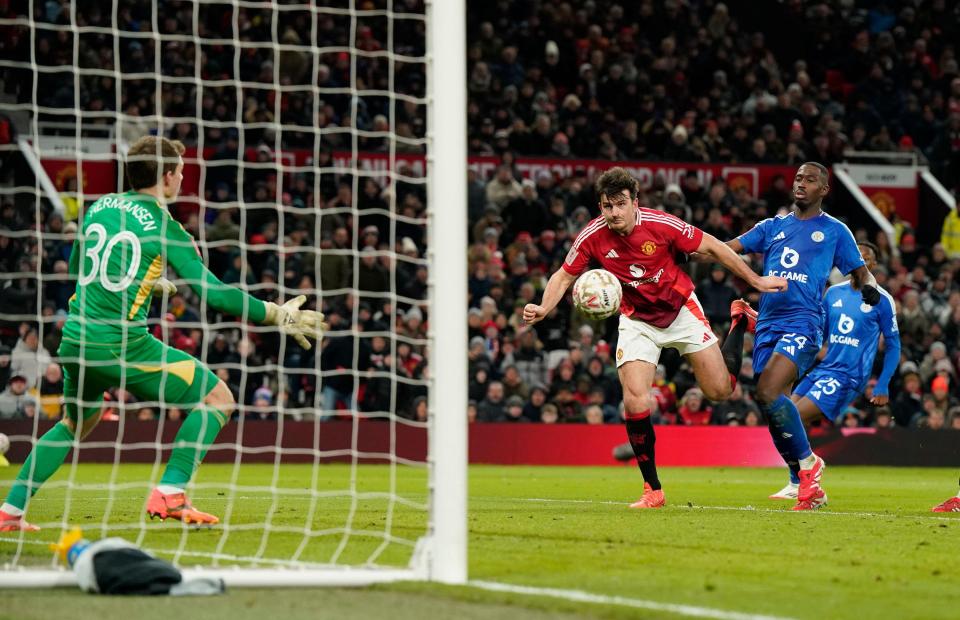 Harry Maguire of Manchester United scores a winning goal during an FA Cup match.