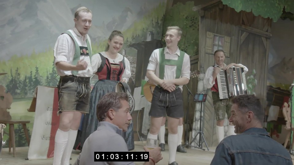 Screengrab of a video showing people in traditional Bavarian attire.