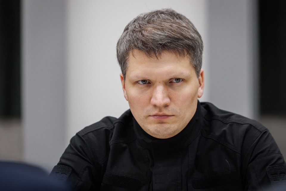 Portrait of a man in a black shirt.