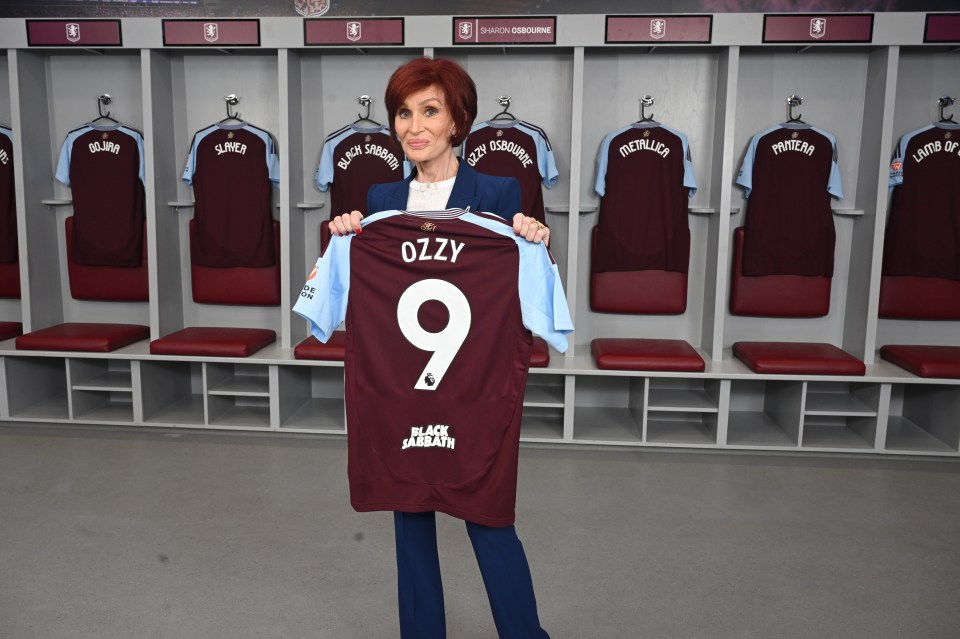 Sharon Osbourne holding a Black Sabbath jersey.