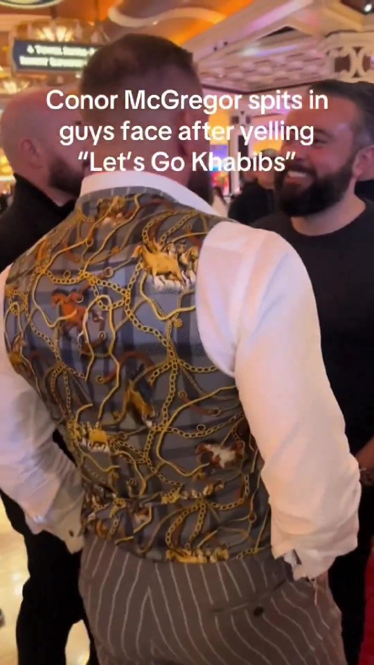 Conor McGregor spitting in a man's face after yelling "Let's Go Khabibs".