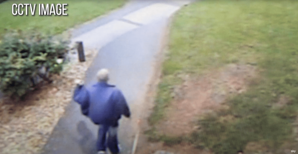 CCTV image of a person walking down a path.