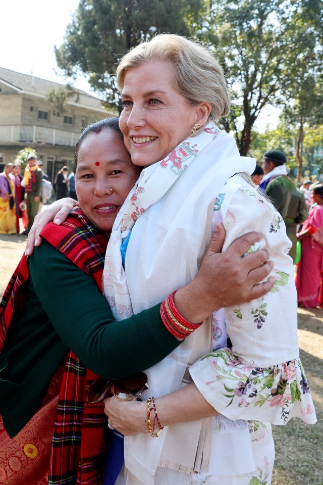 Sophie, Duchess of Edinburgh, embraces a Gurkha graduate's family member at an attestation parade in Nepal.