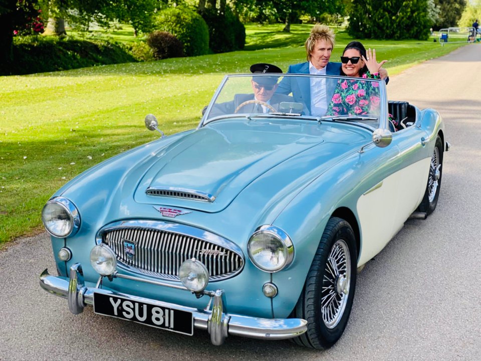 Couple in a classic car.