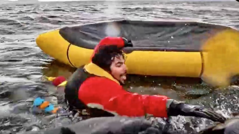 Man in red jacket rescued from water after being swallowed by a whale.