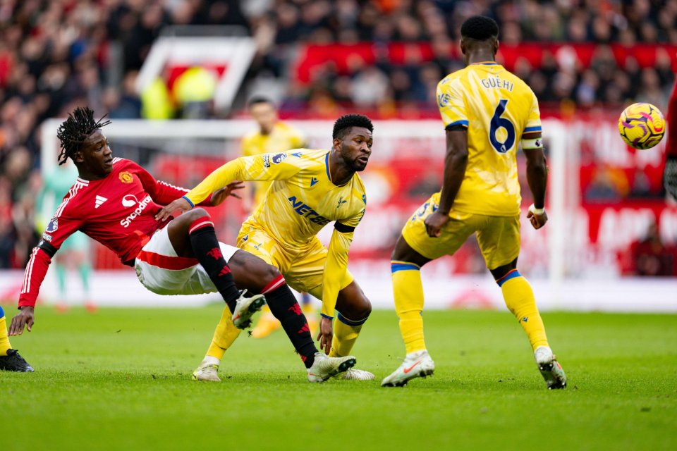 Soccer players competing for the ball.