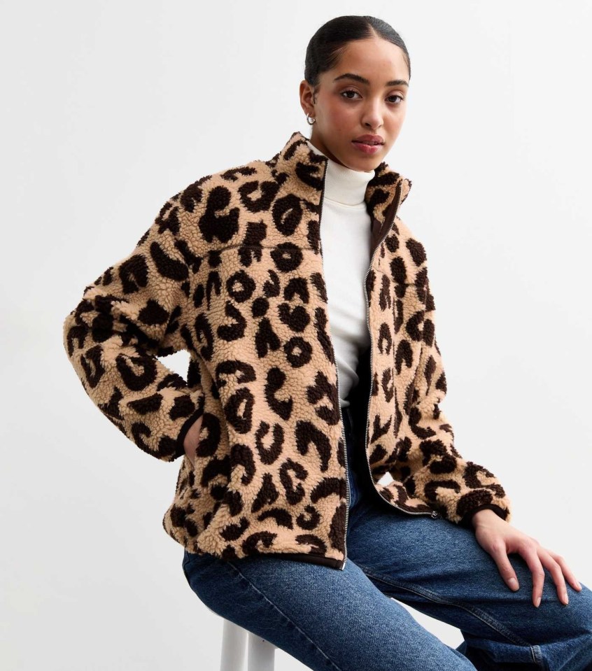 Woman wearing a leopard print borg jacket.