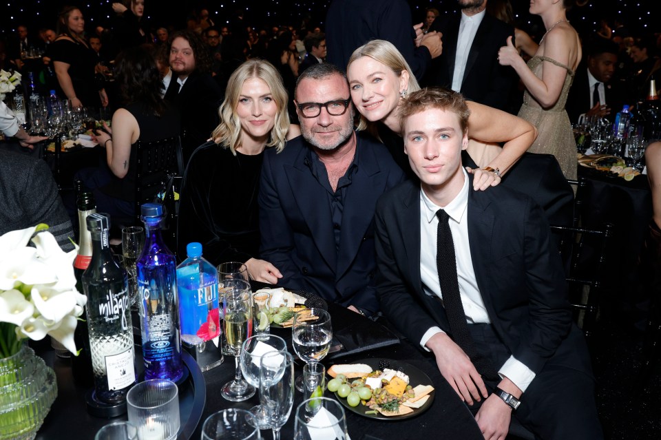 Liev Schreiber, Naomi Watts, and their children at an awards ceremony.