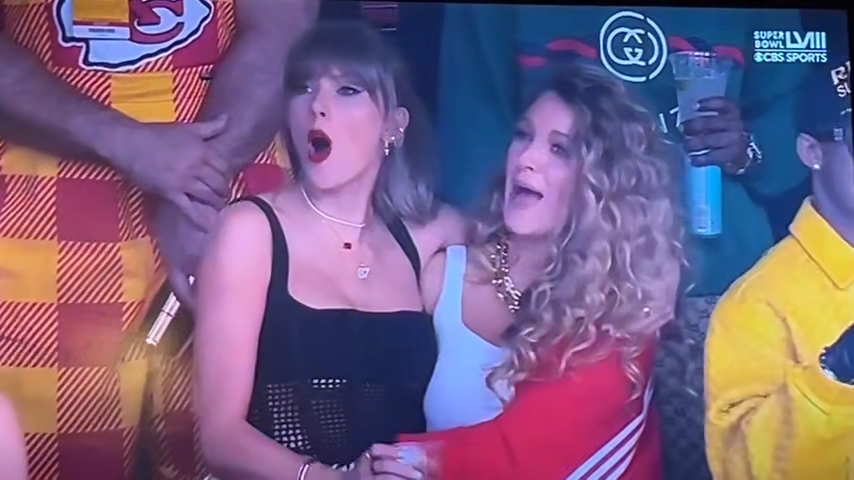 Taylor Swift and Blake Lively reacting to a Super Bowl song.