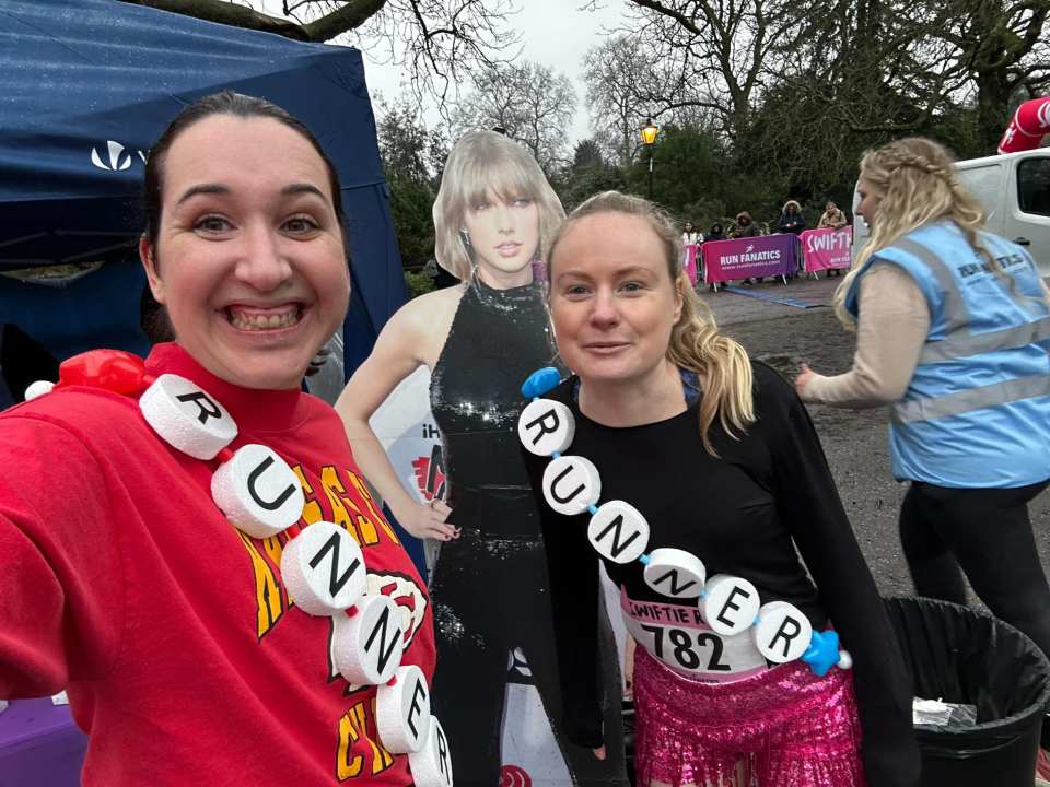 Two women in costume at a Taylor Swift-themed fun run.