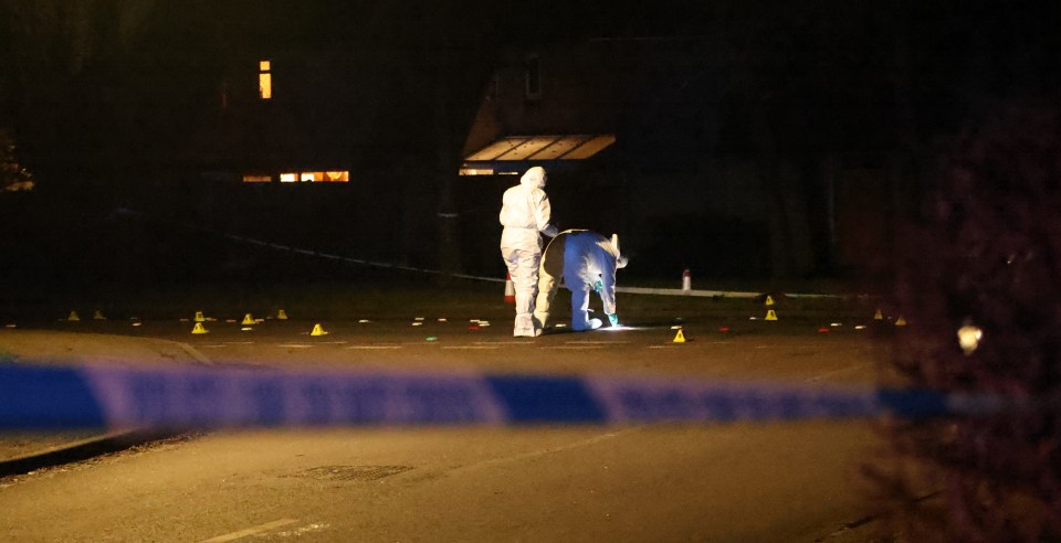 Forensic investigators at a nighttime crime scene.