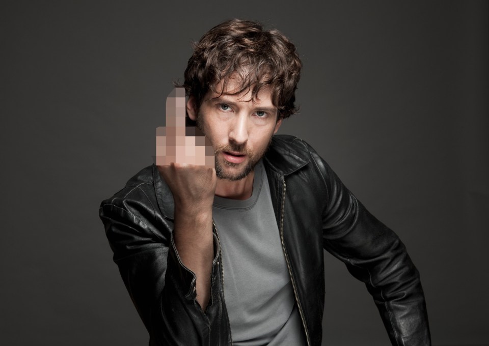 Man in leather jacket giving the middle finger.