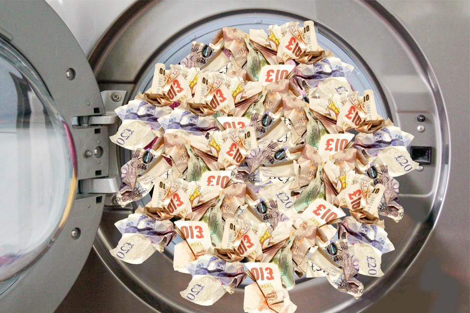 Washing machine filled with crumpled British banknotes.