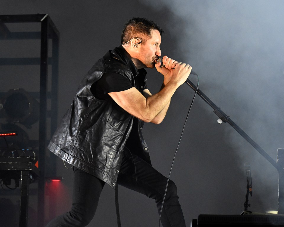 Trent Reznor of Nine Inch Nails performing at a music festival.