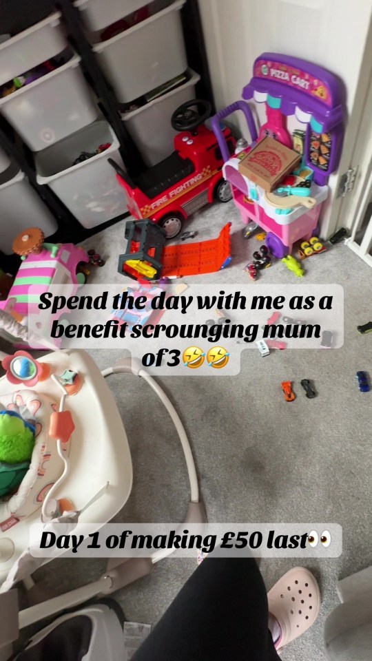 Messy playroom floor with toys and baby equipment; text overlay describes a day in the life of a benefit-receiving mother of three.