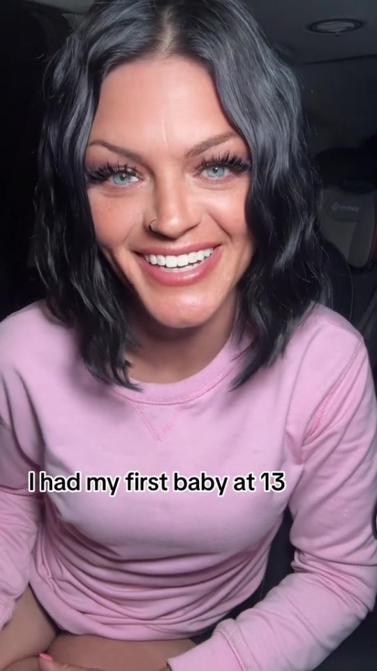 Woman in pink sweatshirt says she had her first baby at 13.