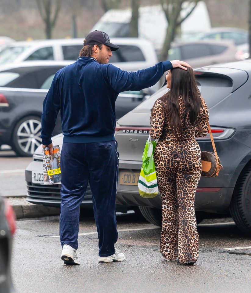 Jack Fincham and Chloe Brockett in a parking lot.