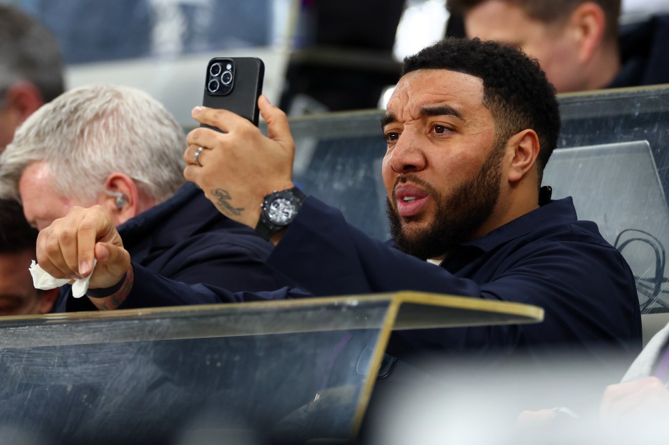 Troy Deeney taking a selfie at a sporting event.