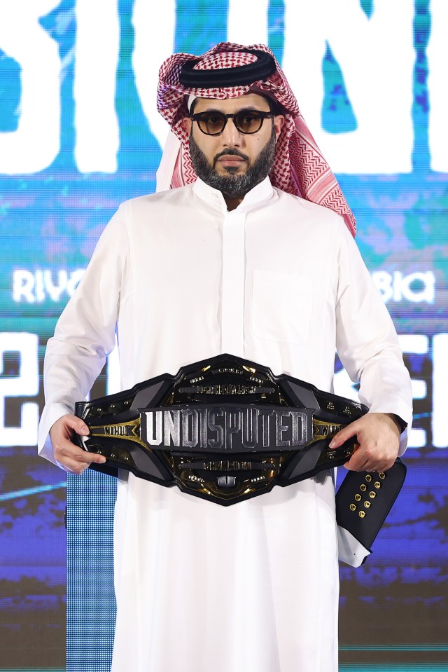 Turki Alalshikh holding the Undisputed championship belt.