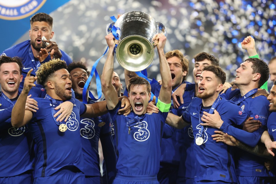 Chelsea players celebrating with the Champions League trophy.