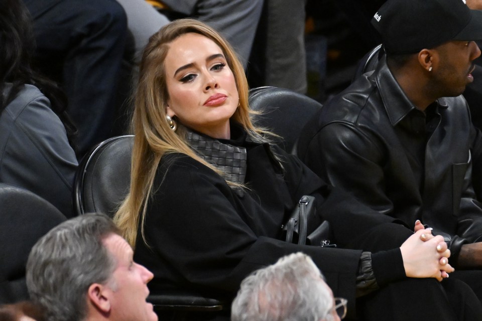 Adele at a basketball game.