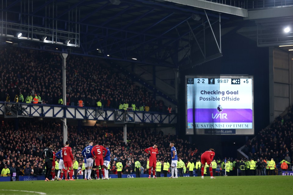 VAR message on a stadium scoreboard: Checking goal, possible offside.