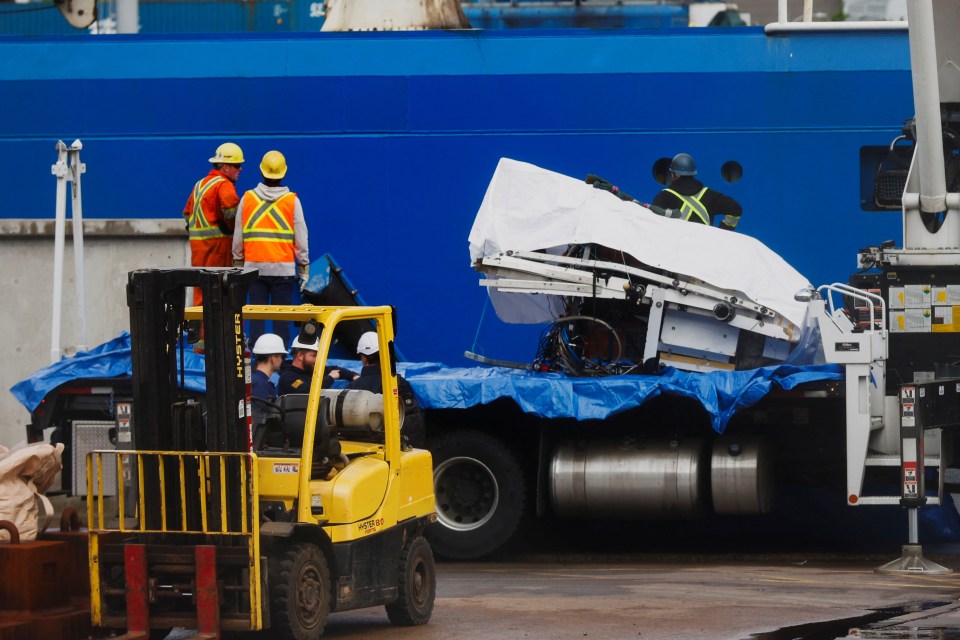 Salvaged Titan submersible pieces being unloaded in St. John's harbour.