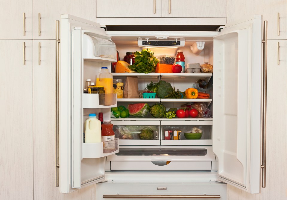 Refrigerator filled with healthy food and drinks.