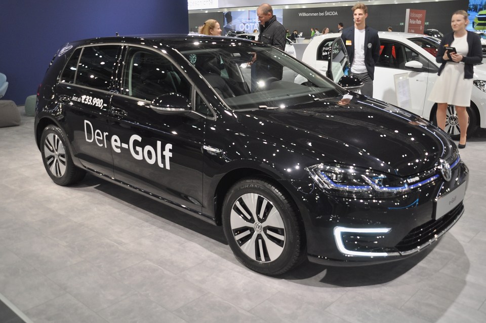 Black Volkswagen e-Golf at a car show.