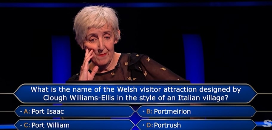 Screenshot of a contestant on Who Wants To Be A Millionaire? considering the answer to a question about a Welsh visitor attraction.